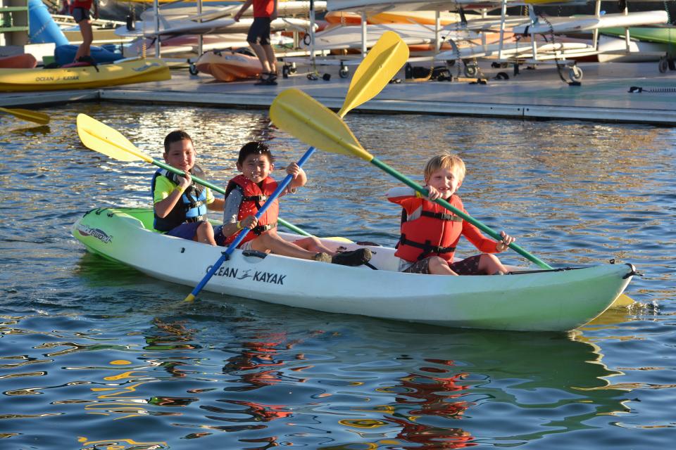 boys paddling in a kayak
