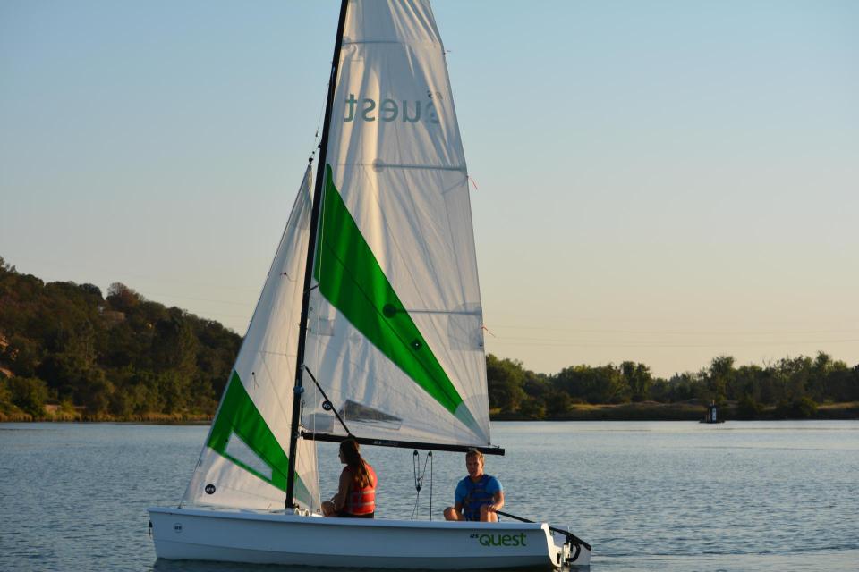 One man and one women in a Quest sailboat on Lake Natoma