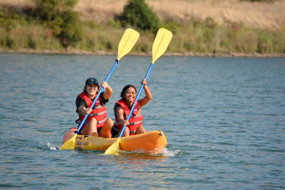 Two people on a tandem kayak