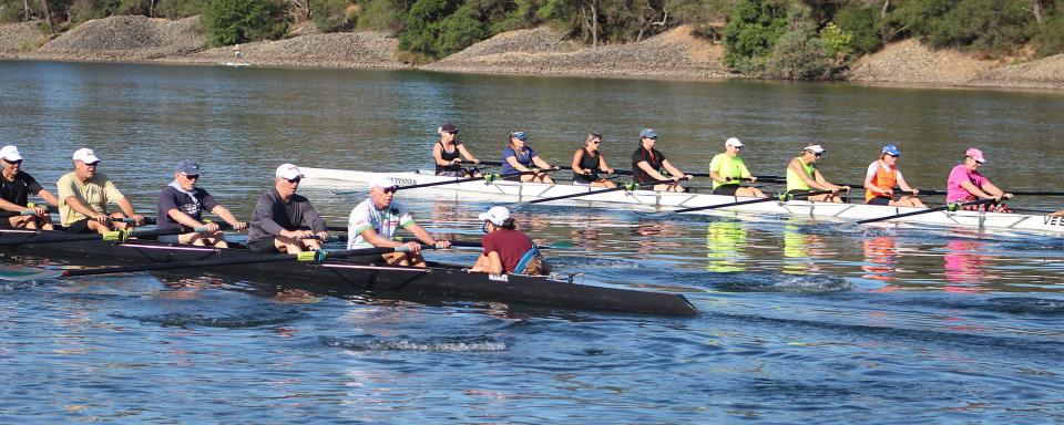 two eight person rowing shells on lake natoma