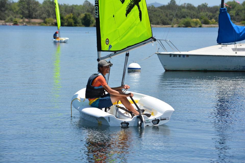 Man sailing a zest sailboat on lake natoma