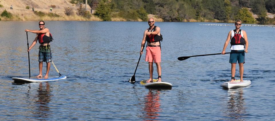 group stand up paddleboarding