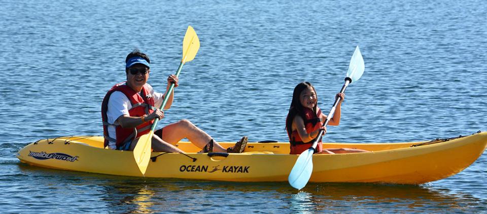 father and daughter kayaking