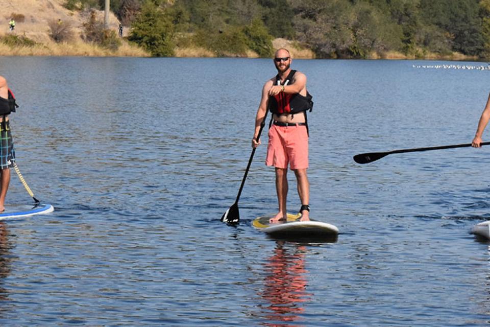 group stand up paddleboarding