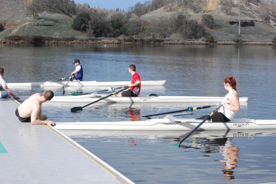 Sac State students learning to row in single rowing shells
