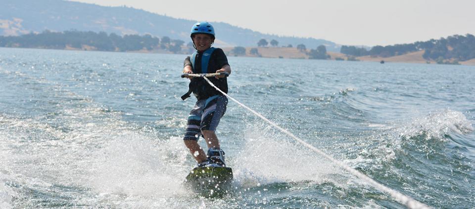 boy wakeboarding on the water